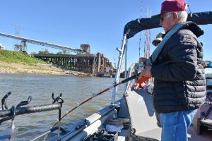 Frayne Berg reels in a hard-hitting Mississippi River channel cat.