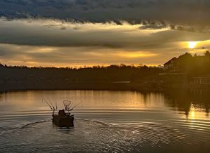 Sunrise illuminates the scene as Marc Cooper and his girlfriend, Katie Allen, launch on Tennessee's Ft. Loudon Lake. (Photo: Richard Simms)