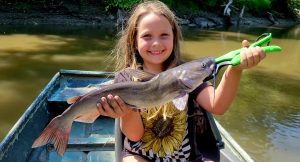 Author’s daughter Ivy with a nice fish caught on dip bait.
