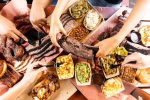 A spread of brisket and beef ribs barbecue and sides from Hutchins BBQ in McKinney, Texas.