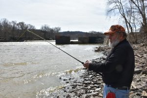 A catfish angler waits for a bite after casting into the Kentucky River below Lock and Dam #2.