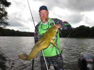 Jay Gallup with a nice post-spawn flathead. Electronics help him find prime areas of cover and structure where he is likely to find fish like this. (Keith Sutton photo)