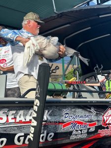 Here is Captain David Magness with a big blue catfish during a weigh in at a catfish tournament. David shares some of his favorite techniques on fishing wood structure in rivers to help you improve your future fishing trips.
