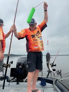 Michael Haney swings a catfish caught on planer boards into the boat on Ross Barnett Lake. Photo by Brent Frazee.