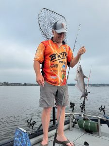 Rodney Crimm knows that planer boards are an effective way to cover water when fishing for scattered blue cats. Photo by Brent Frazee