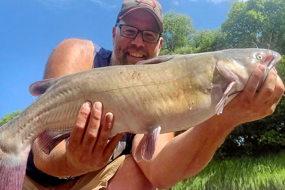 Jeff Miller holding a 29-inch Sheyanne River channel cat.