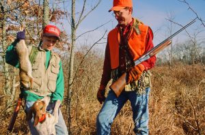 A father and daughter rabbit hunt with beagles on a cold winter day. Small-game hunting is a great pastime to enjoy with youngsters this season.