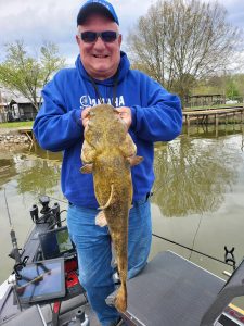 Dan Dannenmueller knows that flathead catfish will hang out in natural and artificial cover. Photo by Brent Frazee