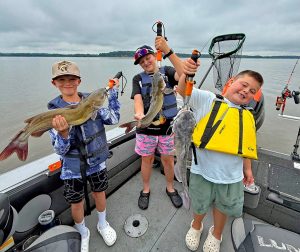 Brecken, Hayden and Carter obviously enjoyed a birthday celebration fishing with Jimmi Brown of Chasin’ Cats. Photo courtesy of Jimmi Brown