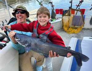 It’s hard to tell who is the proudest of this catch, 7-year-old Hudson or his dad. (Photo by Capt. Owen Koch)