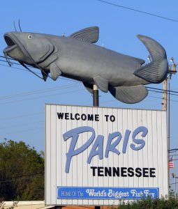 The welcome sign to Paris, Tennessee showcases how central catfishing is to the culture of this southern town. (Photo by Monte Starks)