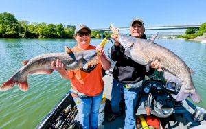 The author and his daughter, Melissa, with a double caught by drift fishing into a deep hole. (Photo by Capt. Richard Simms)
