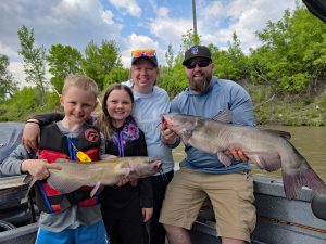 The Myhre family from Fargo, North Dakota has been fishing with Capt. Durick on the Red River for many years. He says photos from their trips have become their annual Christmas card photos.