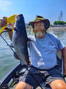 CatfishNOW Editor Keith “Catfish” Sutton shows off a good “eater blue” caught drifting the turbines immediately below Chickamauga Dam in Chattanooga.