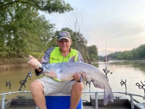 Michael Haney shows off a typical size blue catfish caught fishing around wood structure in the Yazoo River.