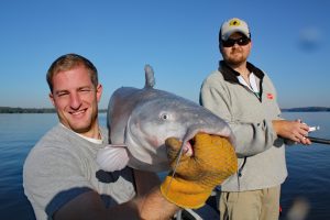 Sam Simons (left) caught this big blue vertical fishing not far upstream from Wilson Lake Dam, fishing with Capt. Mike Mitchell. (Photo by Richard Simms)
