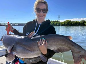 Crystal Jellison occasionally enjoys being “guided” on a trophy catfishing trip with her husband. (Photo by Capt. Joe Jellison)