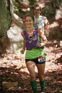 Crystal Jellison and her brother, Noah Graydon, during a 50-mile ultra race. These rugged race trails often lead runners up and down, climbing thousands of feet in elevation over the 50-mile course. (Photo by Sarah Buckner, www.sarahbucknerphoto.com)