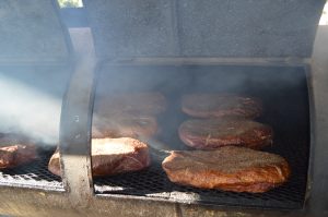 The heart of Booth's BBQ is its smoker, where patience, hardwood smoke and time transform quality meats into authentic Southern barbecue. (Kyleigh Touro photo)