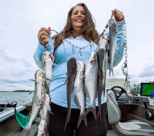 Jill Bruce with a few of the 60 catfish caught in four hours from Lake Monticello on our short trip. Fun day for all.